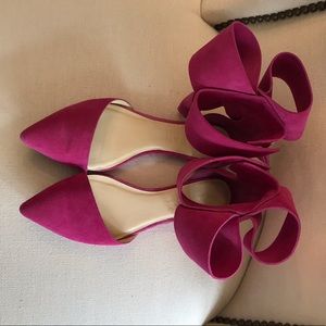 Suede flat with large ankle bow
